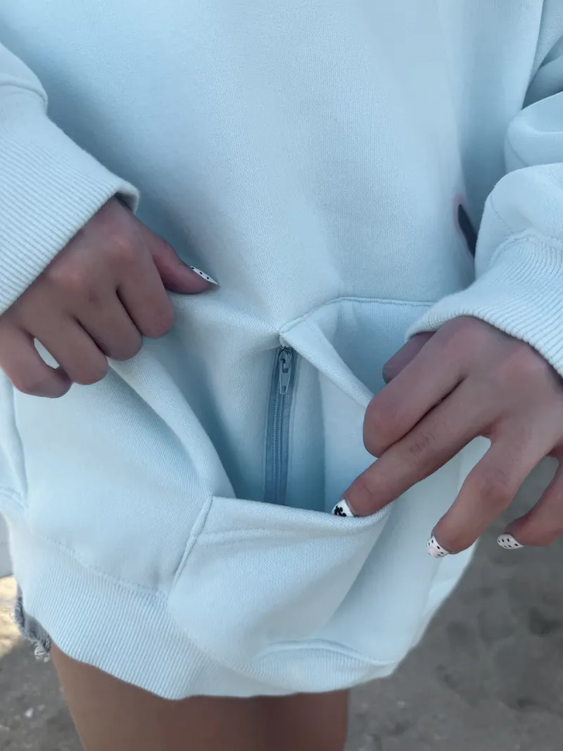 The zipper pocket inside the front pocket