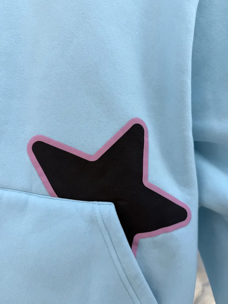 Close-up of the pocket star, brown with a raised pink outline